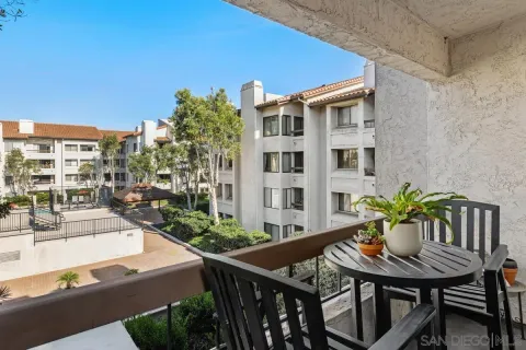 a view of a balcony and chairs