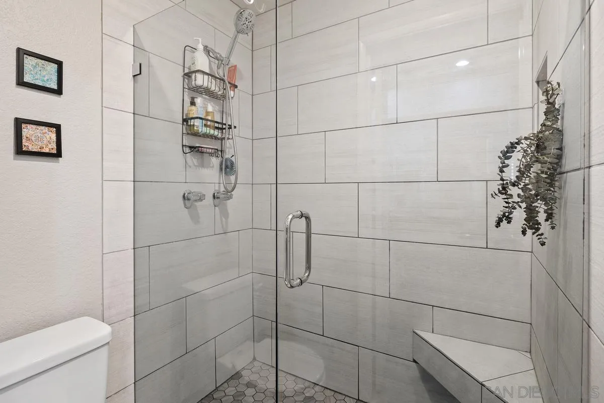 5605 Friars Road, Unit 308 San Diego, CA 92110 - Photo 18 of 39 a bathroom with a toilet and shower