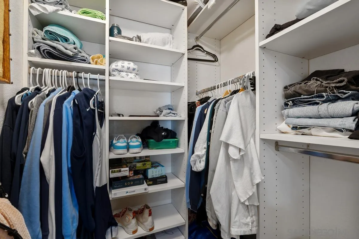 5605 Friars Road, Unit 308 San Diego, CA 92110 - Photo 19 of 39 a view of walk in closet with clothes and shoes