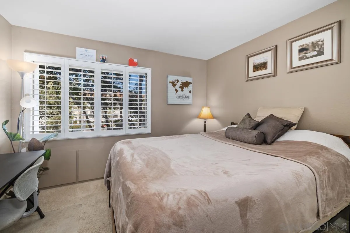 5605 Friars Road, Unit 308 San Diego, CA 92110 - Photo 20 of 39 a bedroom with a bed and a window