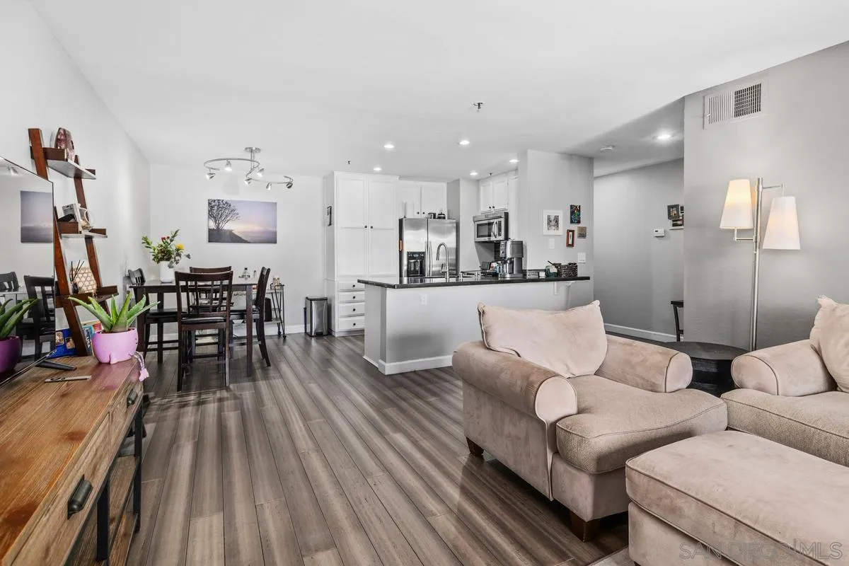 5605 Friars Road, Unit 308 San Diego, CA 92110 - Photo 2 of 39 a living room with furniture and wooden floor