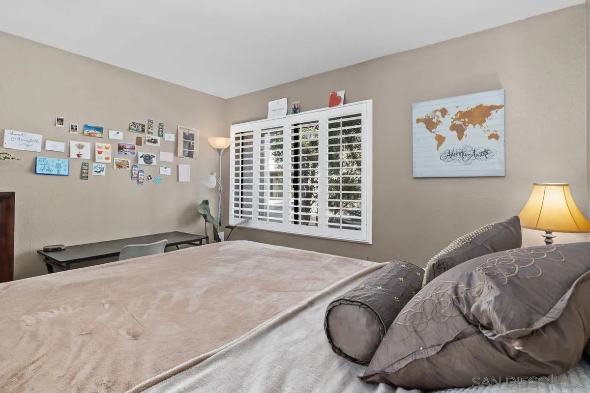 5605 Friars Road, Unit 308 San Diego, CA 92110 - Photo 21 of 39 a bedroom with bed and a couch