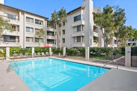 a view of a swimming pool with a lounge chairs