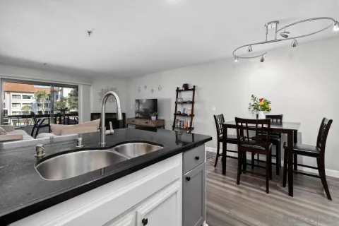 a kitchen with a dining table and chairs