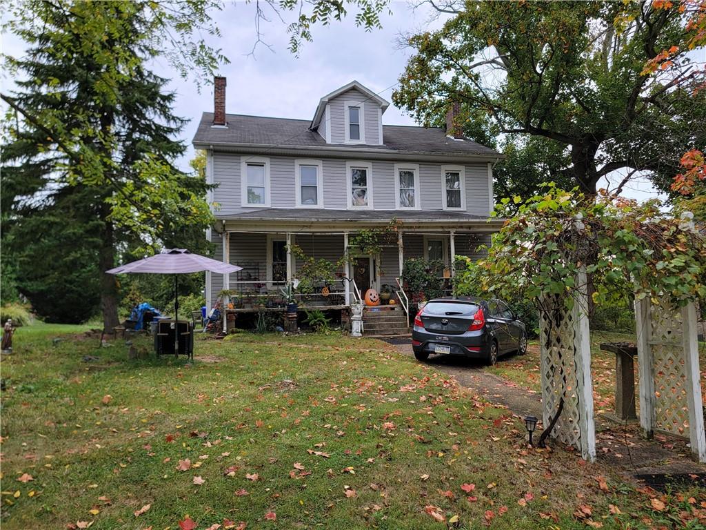 165 Herbst Road Coraopolis, PA 15108 - Photo 3 of 5 a car parked in front of a house