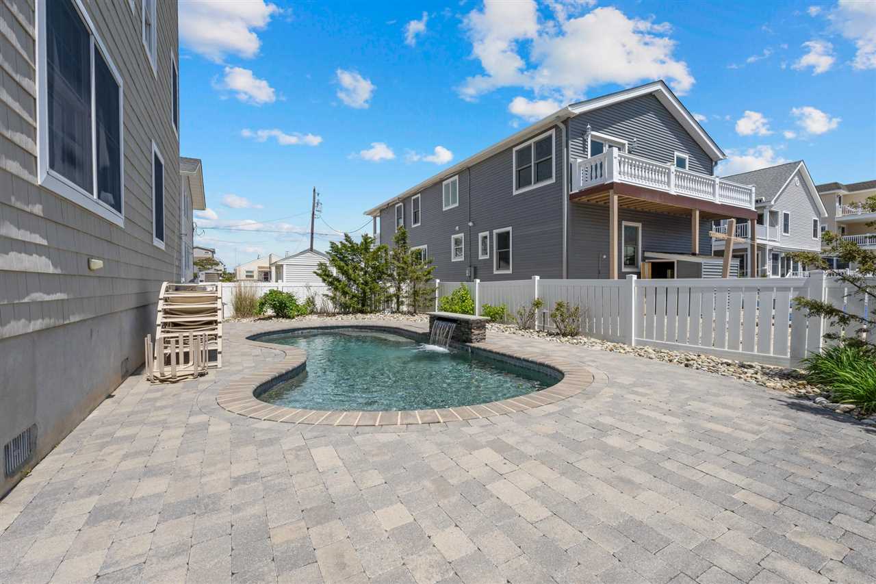 5441 Ocean Drive Avalon, NJ 08202 - Photo 24 of 26 a front view of a house with a yard
