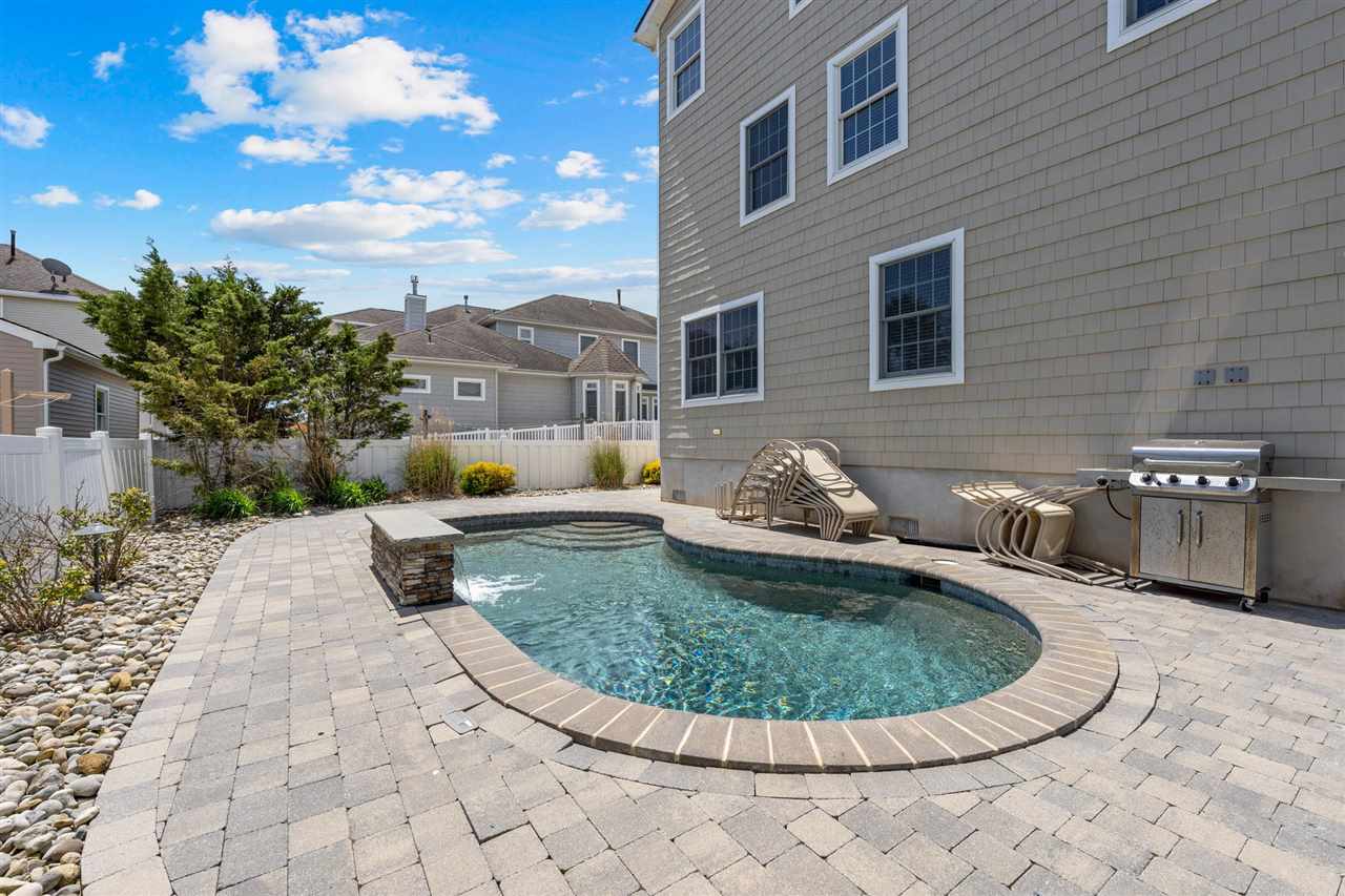 5441 Ocean Drive Avalon, NJ 08202 - Photo 25 of 26 a view of a swimming pool with seating