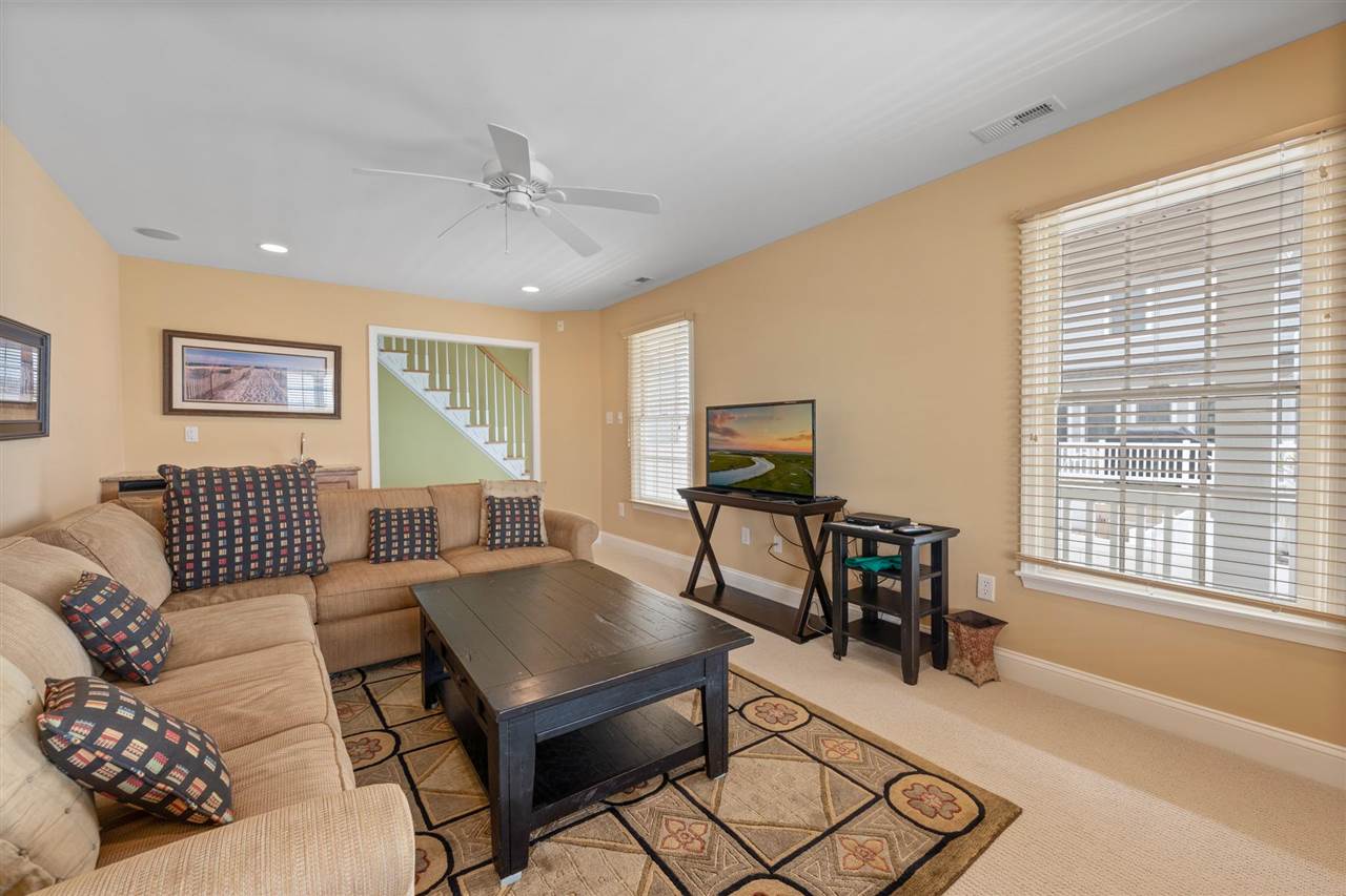 5441 Ocean Drive Avalon, NJ 08202 - Photo 5 of 26 a living room with furniture and a flat screen tv