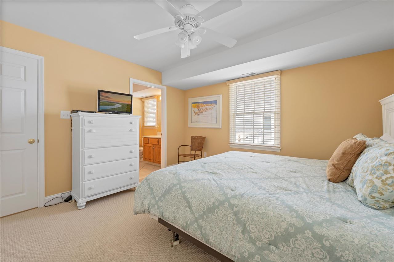 5441 Ocean Drive Avalon, NJ 08202 - Photo 6 of 26 a bedroom with a bed and a dresser