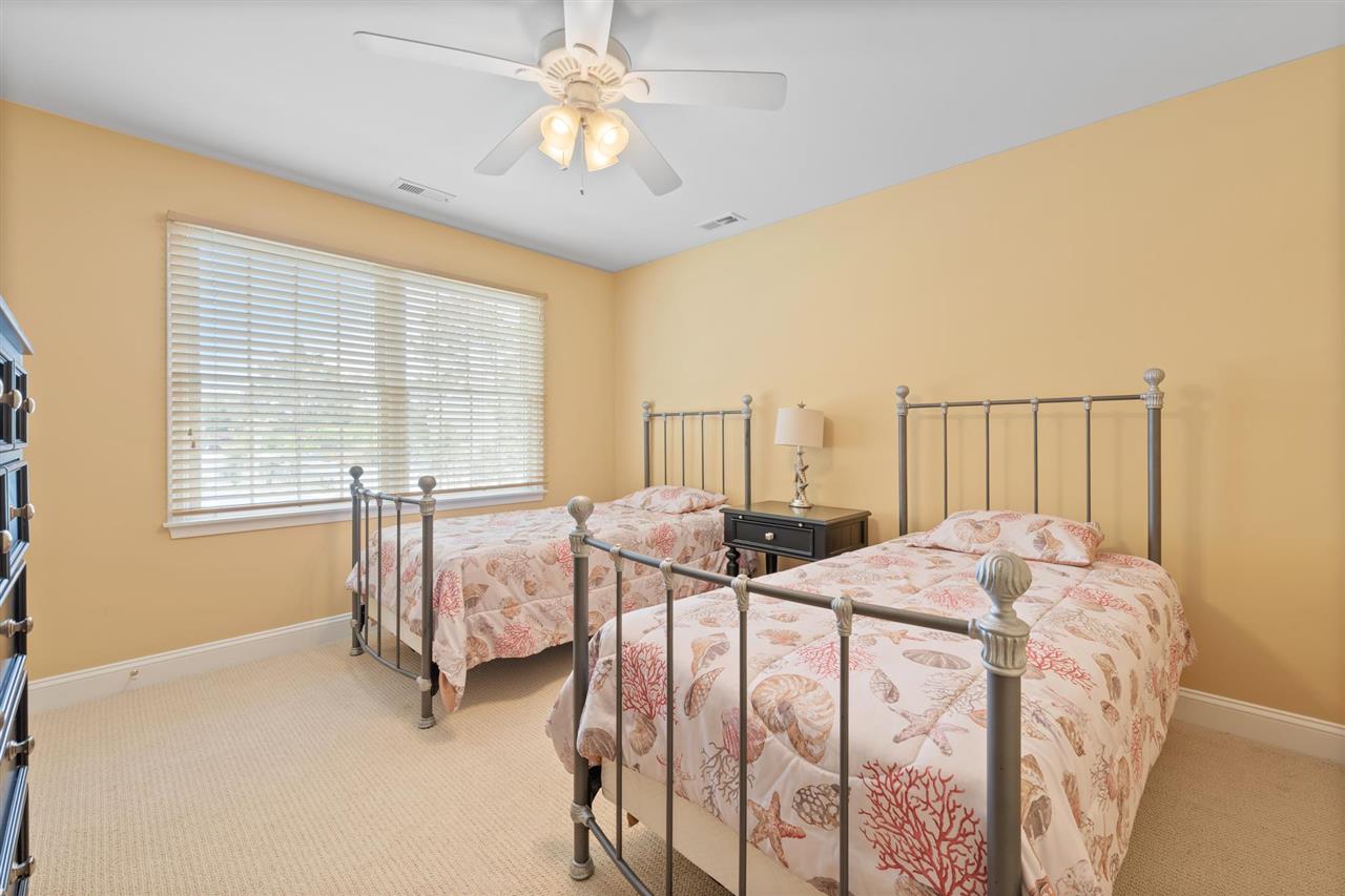 5441 Ocean Drive Avalon, NJ 08202 - Photo 7 of 26 a bedroom with two beds and a chandelier