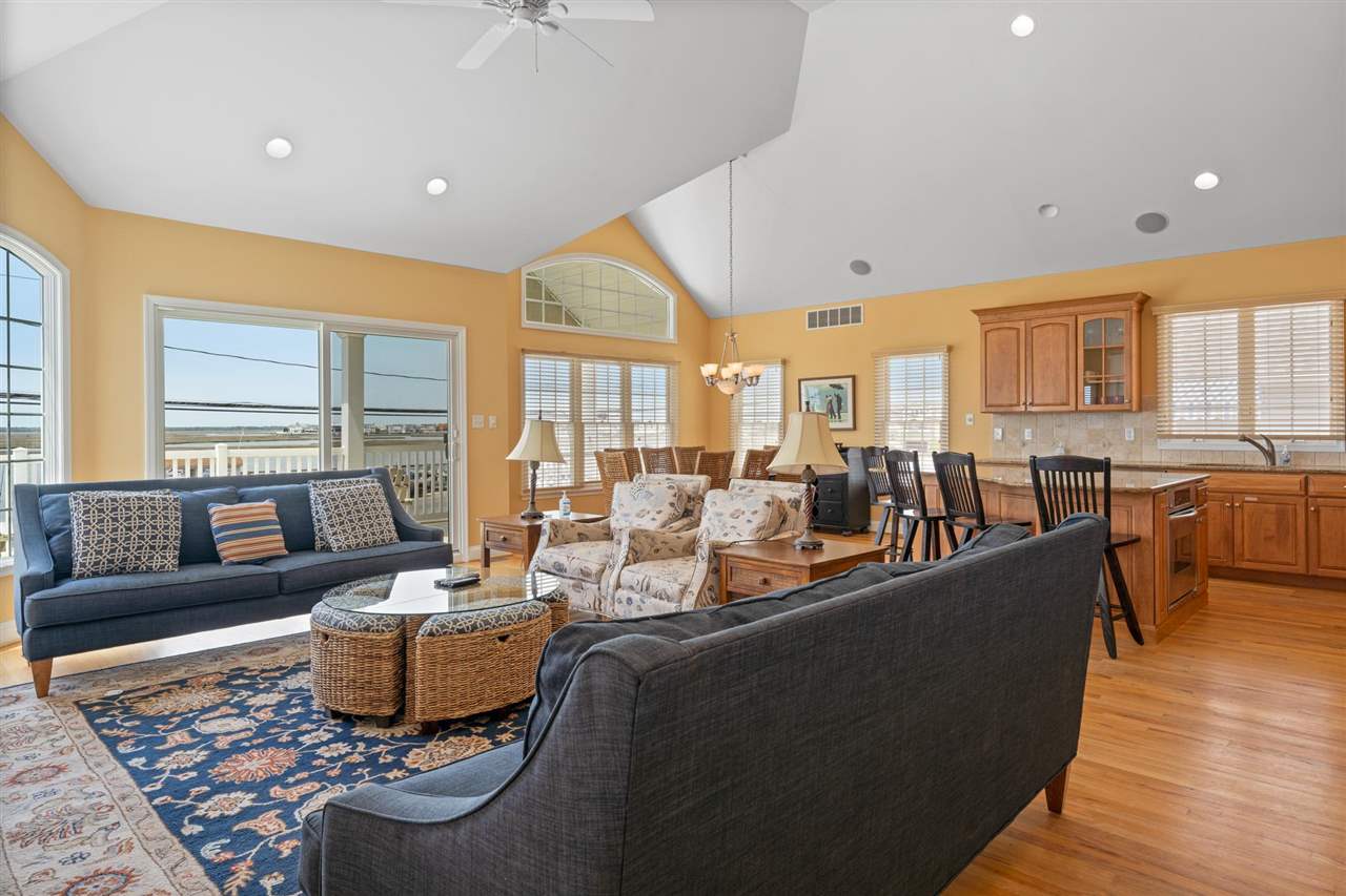 5441 Ocean Drive Avalon, NJ 08202 - Photo 10 of 26 a living room with furniture kitchen area and large windows