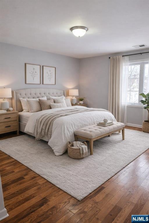 21 Rose Street Paterson, NJ 07501 - Photo 4 of 4 a bedroom with a large bed and a large window