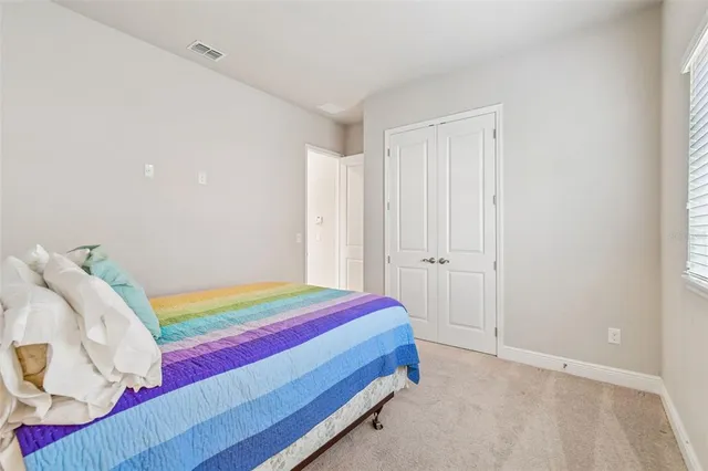 a room with a bed and a window