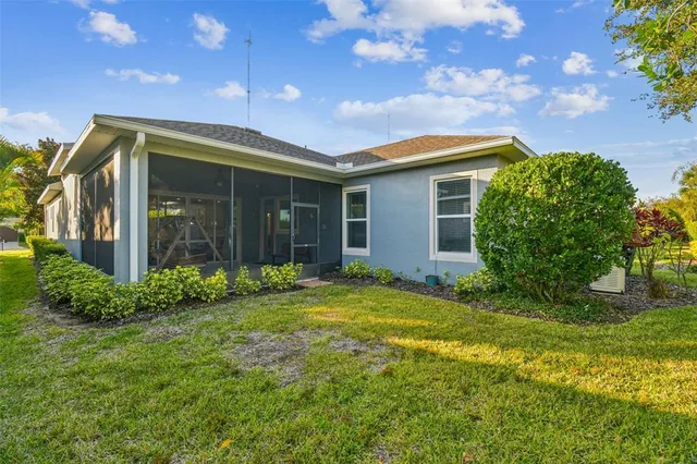 a view of a patio with a table and chairs and potted plants