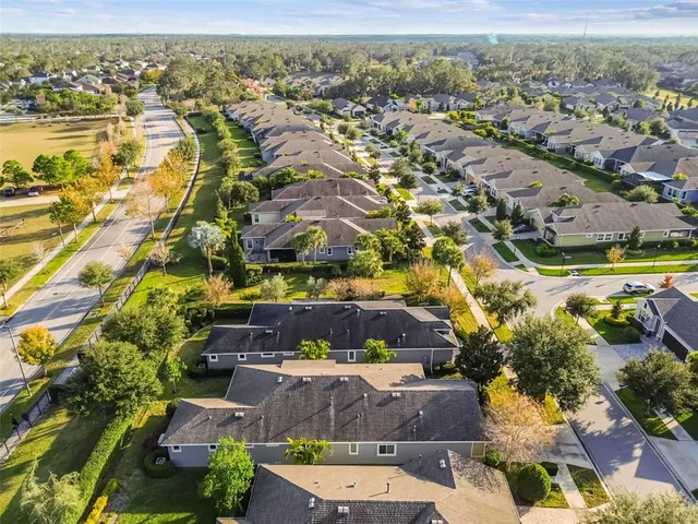 a view of a yard with plants and lake view