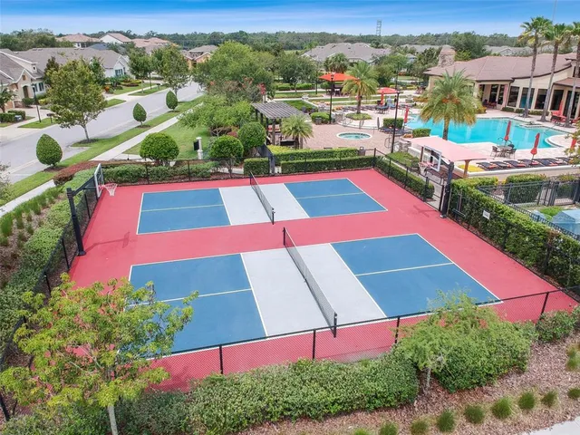 an aerial view of residential houses and swimming pool
