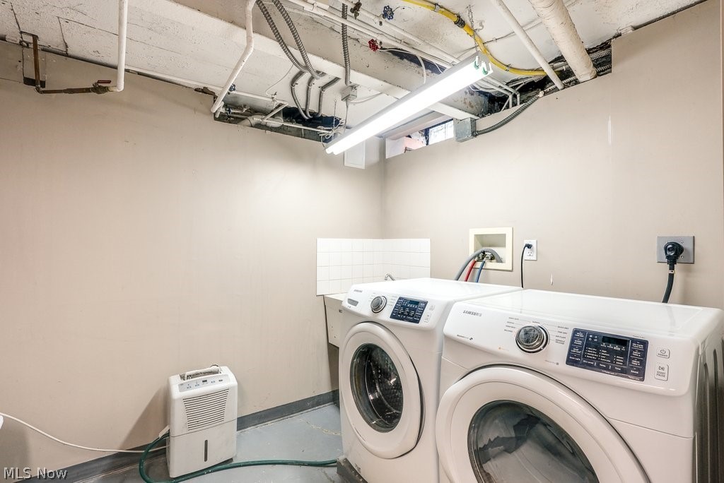 16010 Fernway Road Cleveland, OH 44120 - Photo 26 of 30 Laundry room with washing machine and dryer, hookup for an electric dryer, and hookup for a washing machine