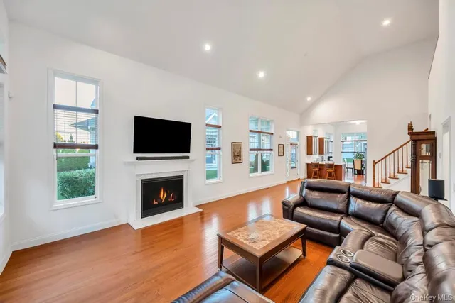 a living room with fireplace furniture and a flat screen tv