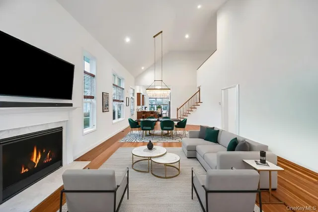 a living room with furniture fireplace and flat screen tv
