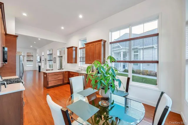 a dining room with furniture and wooden floor