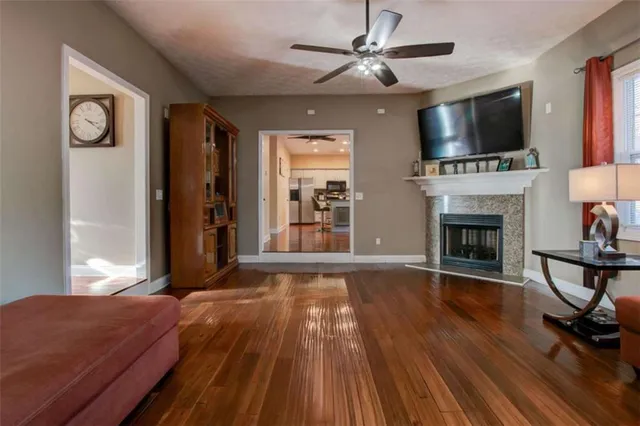 a living room with furniture fireplace and flat screen tv