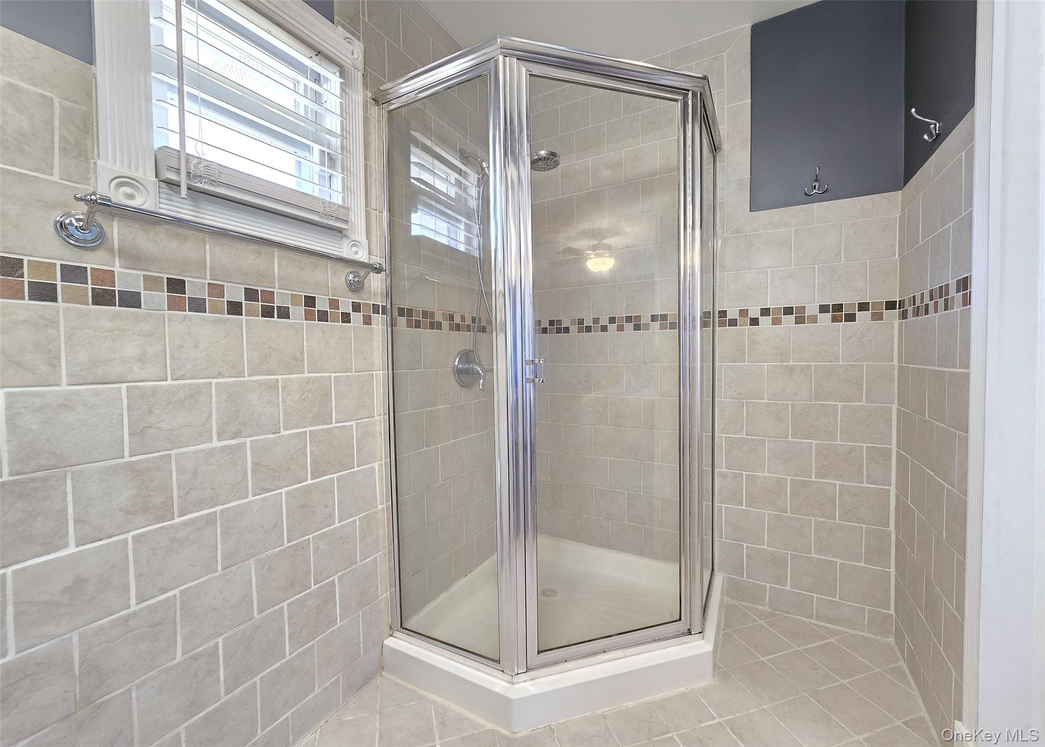 6 Virginia Road Centereach, NY 11720 - Photo 13 of 23 a bathroom with a glass shower door