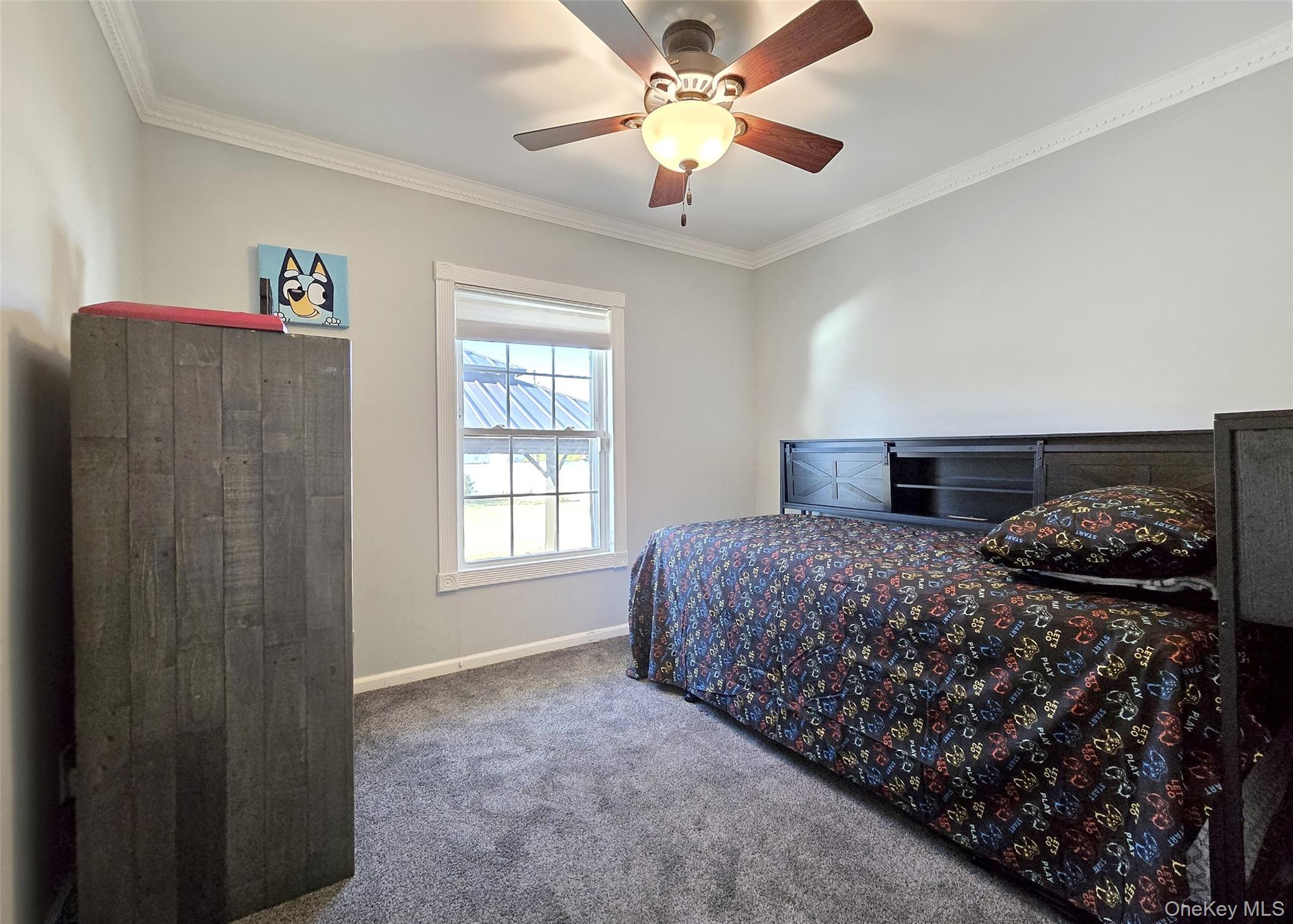 6 Virginia Road Centereach, NY 11720 - Photo 15 of 23 a bedroom with a bed and a chandelier