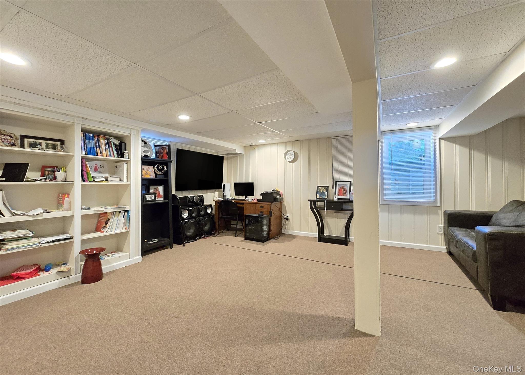 6 Virginia Road Centereach, NY 11720 - Photo 18 of 23 a room with furniture and a flat screen tv