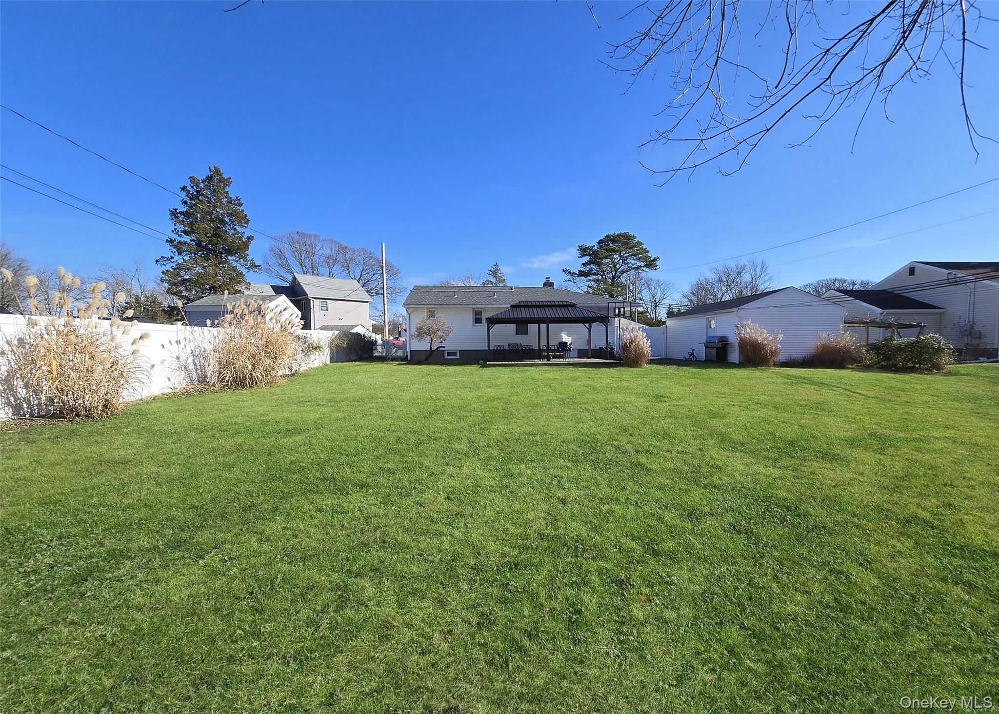 6 Virginia Road Centereach, NY 11720 - Photo 22 of 23 a view of a house with a yard