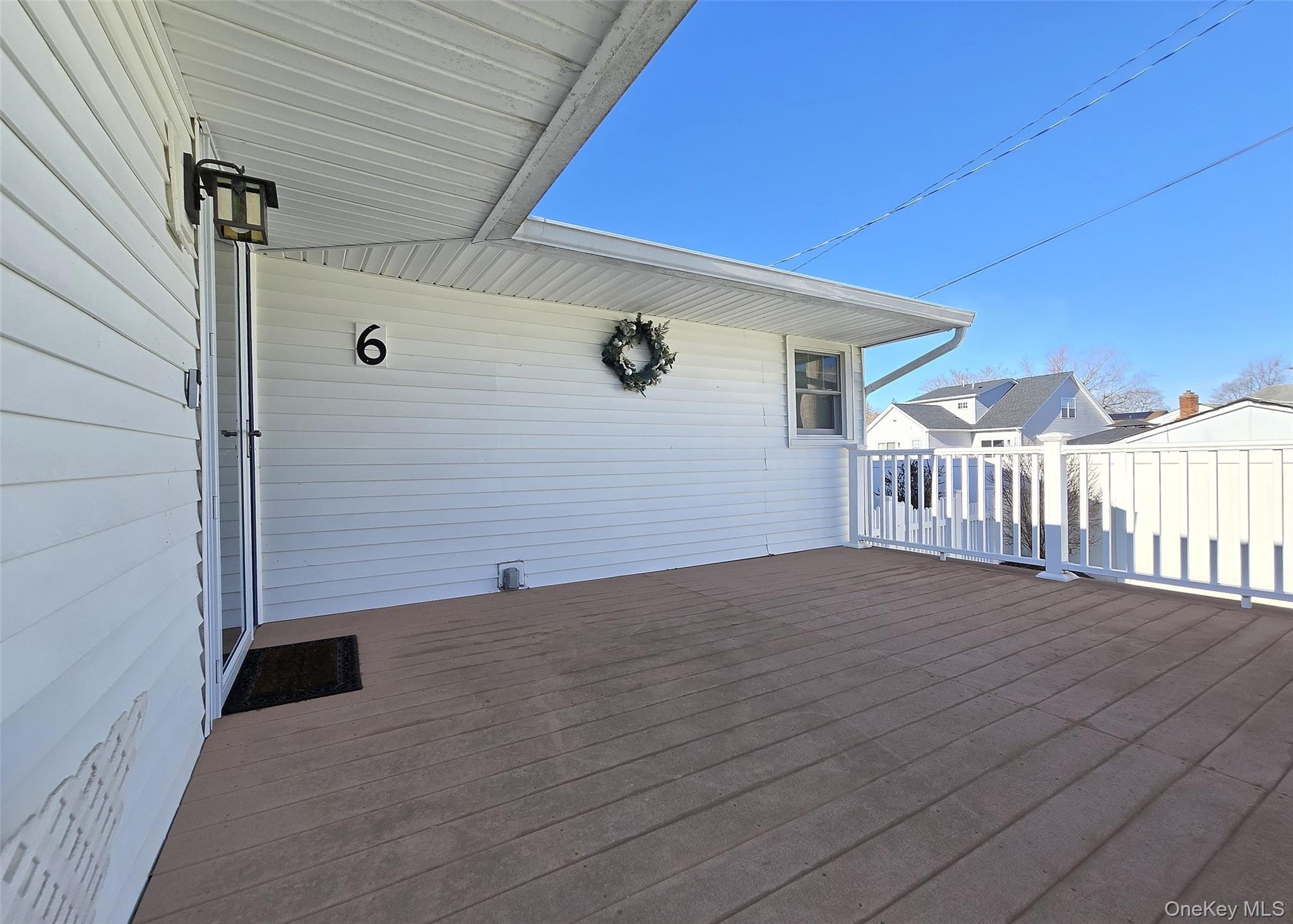 6 Virginia Road Centereach, NY 11720 - Photo 3 of 23 a view of an empty room with wooden floor
