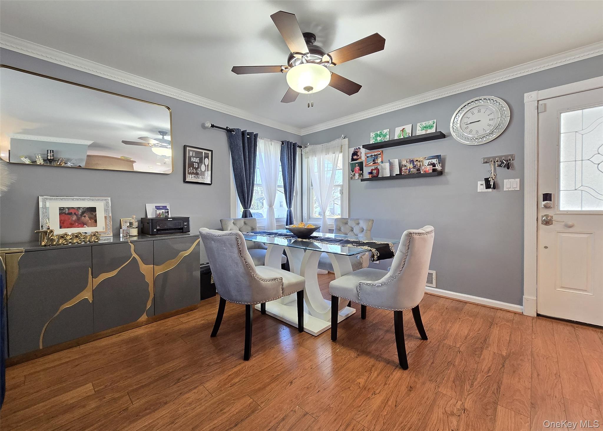6 Virginia Road Centereach, NY 11720 - Photo 9 of 23 a view of a dining room with furniture and wooden floor