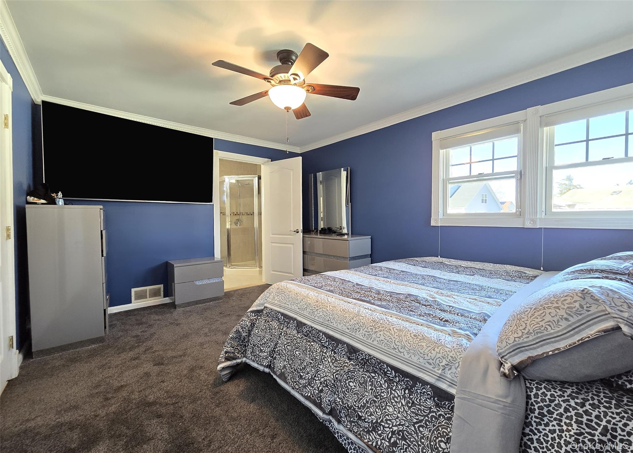 6 Virginia Road Centereach, NY 11720 - Photo 10 of 23 a bedroom with a bed and a flat screen tv