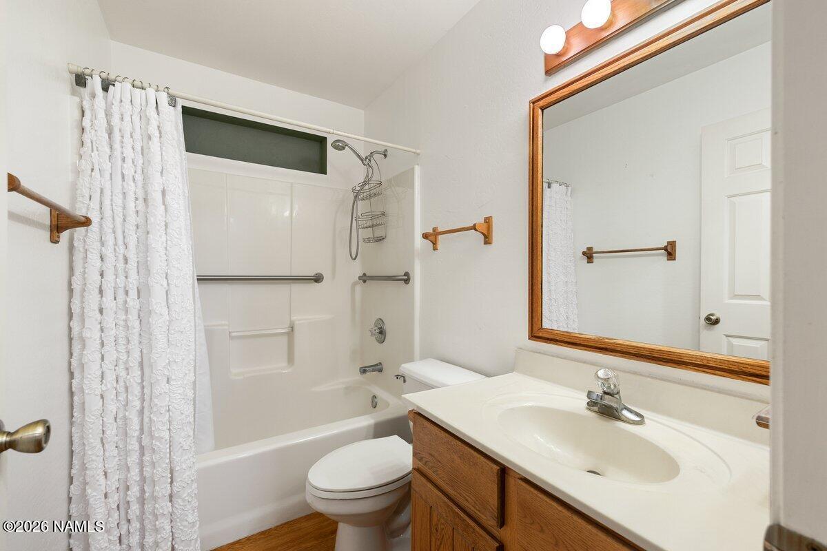 5535 East Western Star Road Flagstaff, AZ 86004 - Photo 19 of 49 a bathroom with a sink toilet and shower