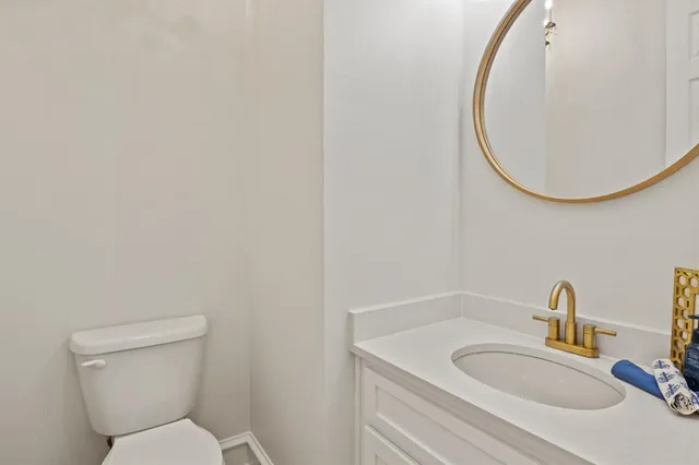 a bathroom with a toilet and a sink