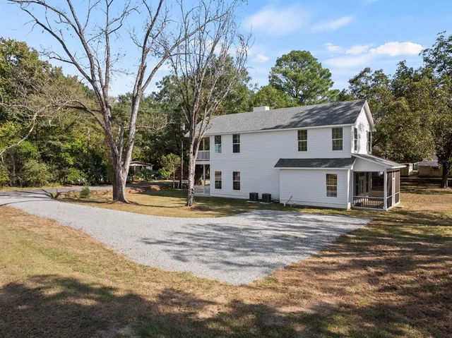 a view of a house with a snow on the background