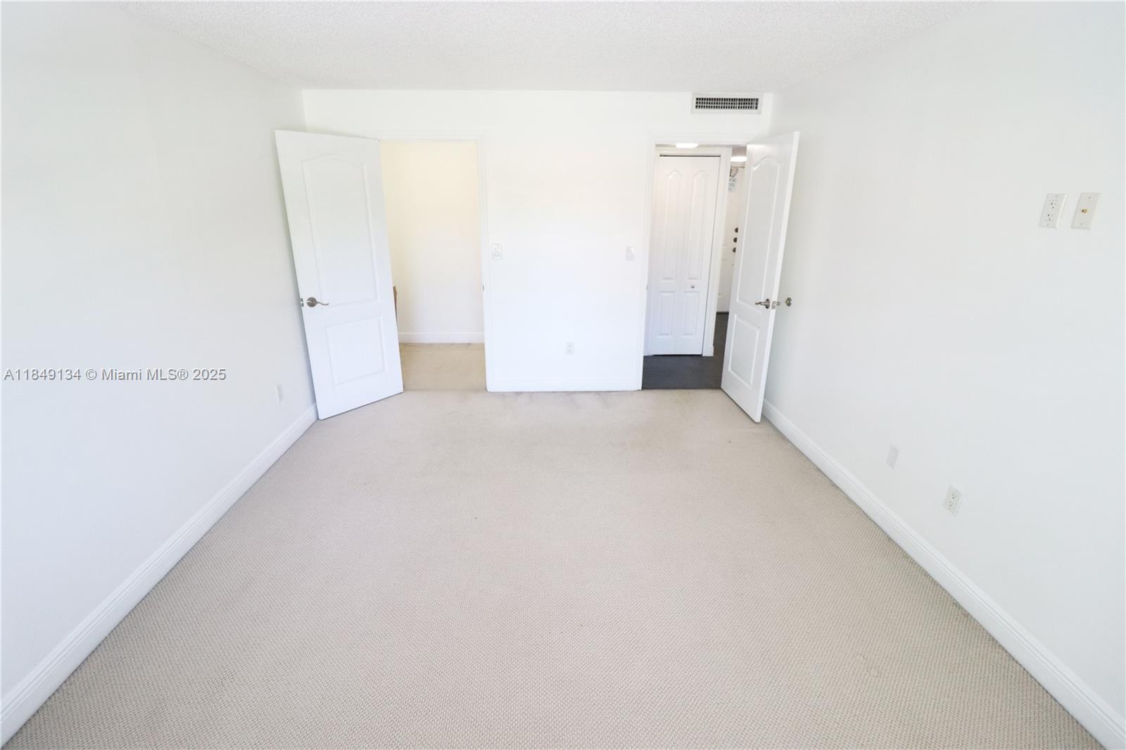 9301 Southwest 92nd Avenue, Unit A210 Miami, FL 33176 - Photo 11 of 25 a view of a big room with closet and wooden floor