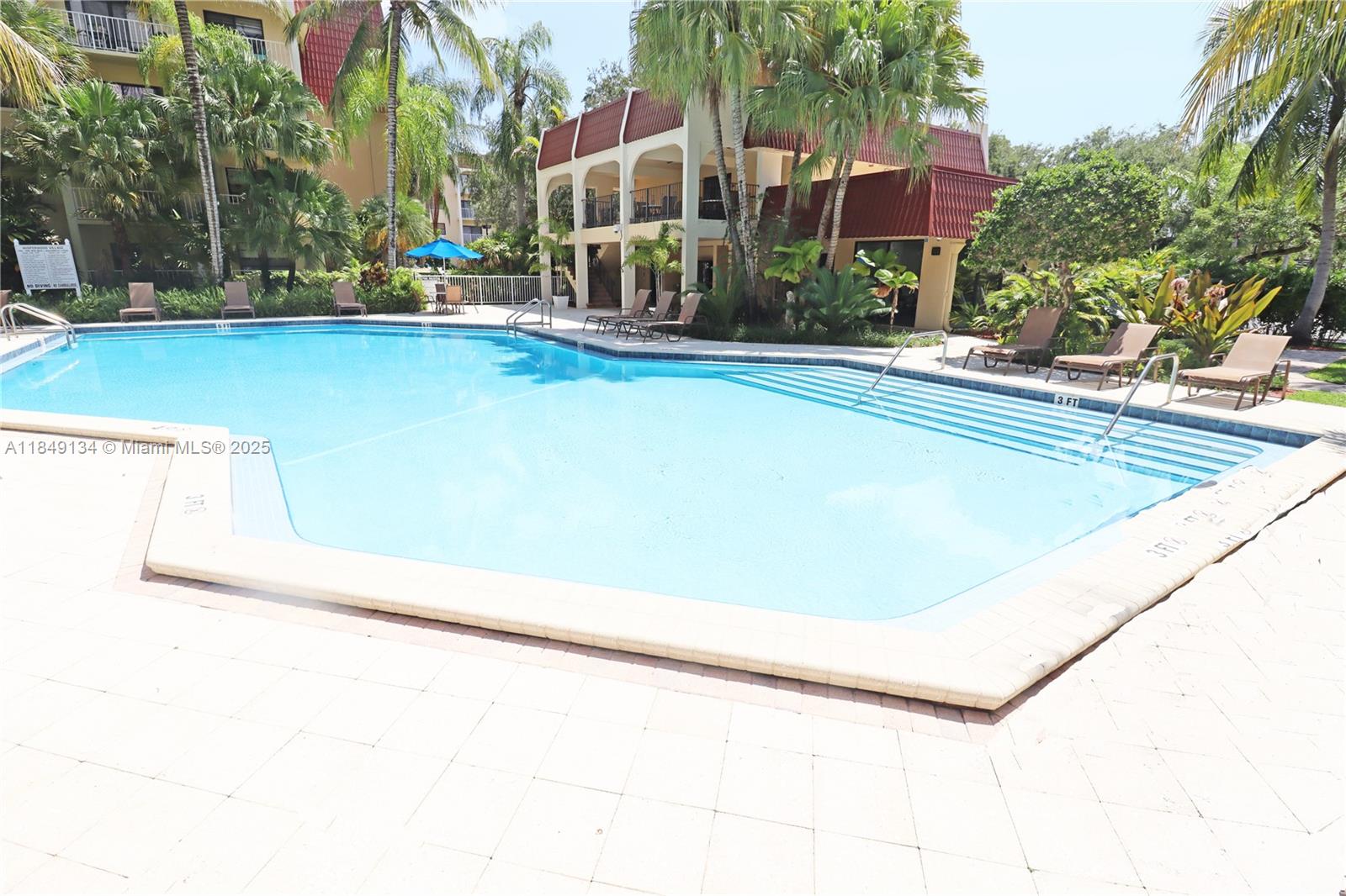 9301 Southwest 92nd Avenue, Unit A210 Miami, FL 33176 - Photo 19 of 25 a view of swimming pool