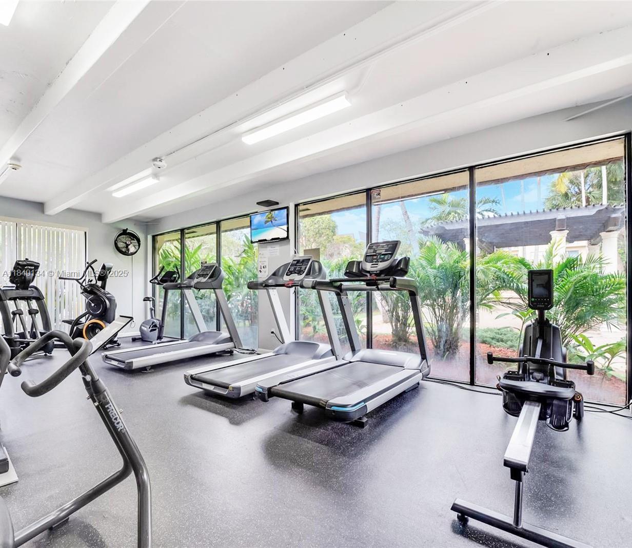 9301 Southwest 92nd Avenue, Unit A210 Miami, FL 33176 - Photo 21 of 25 a view of a room with gym equipment