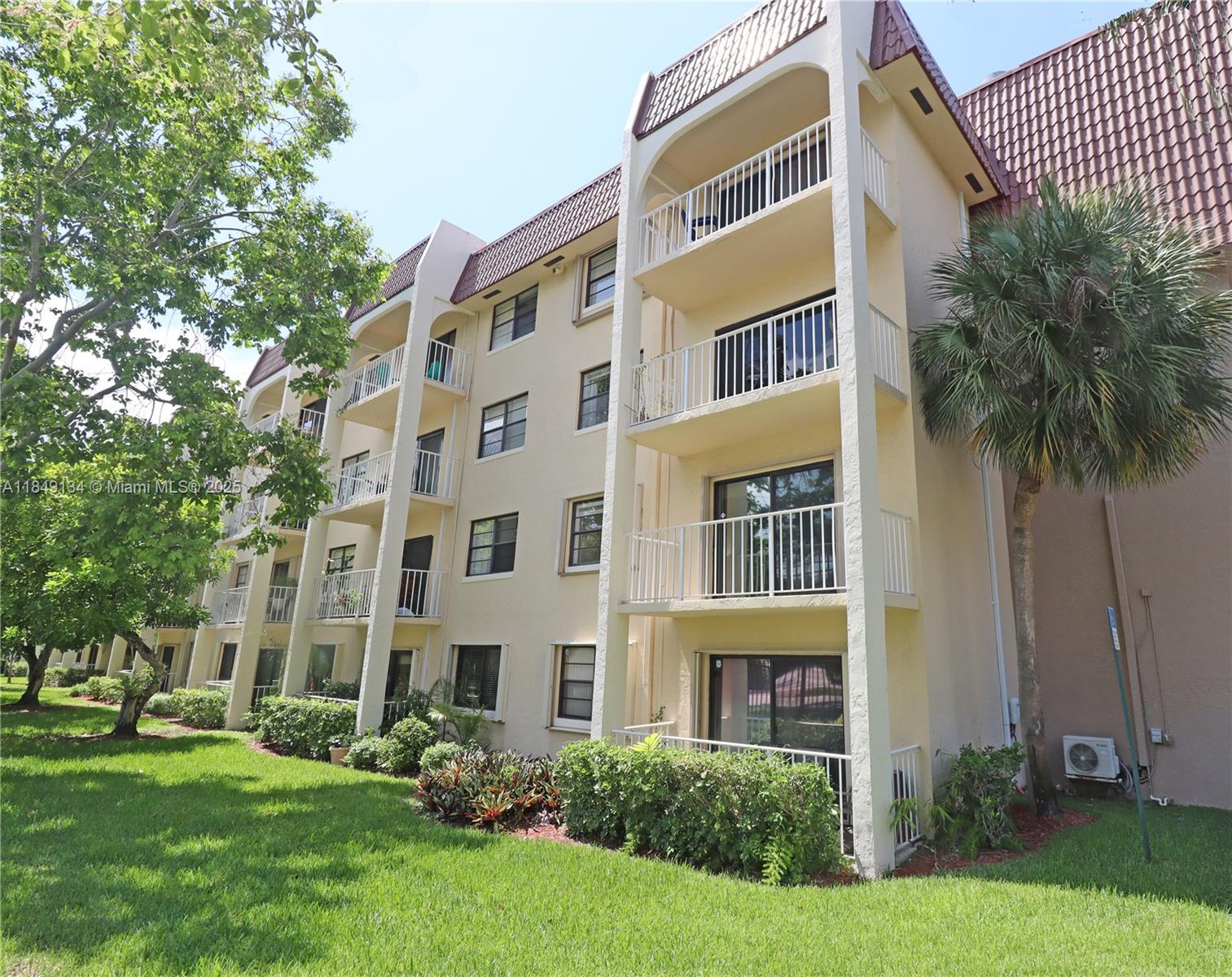 9301 Southwest 92nd Avenue, Unit A210 Miami, FL 33176 - Photo 5 of 25 a front view of a building