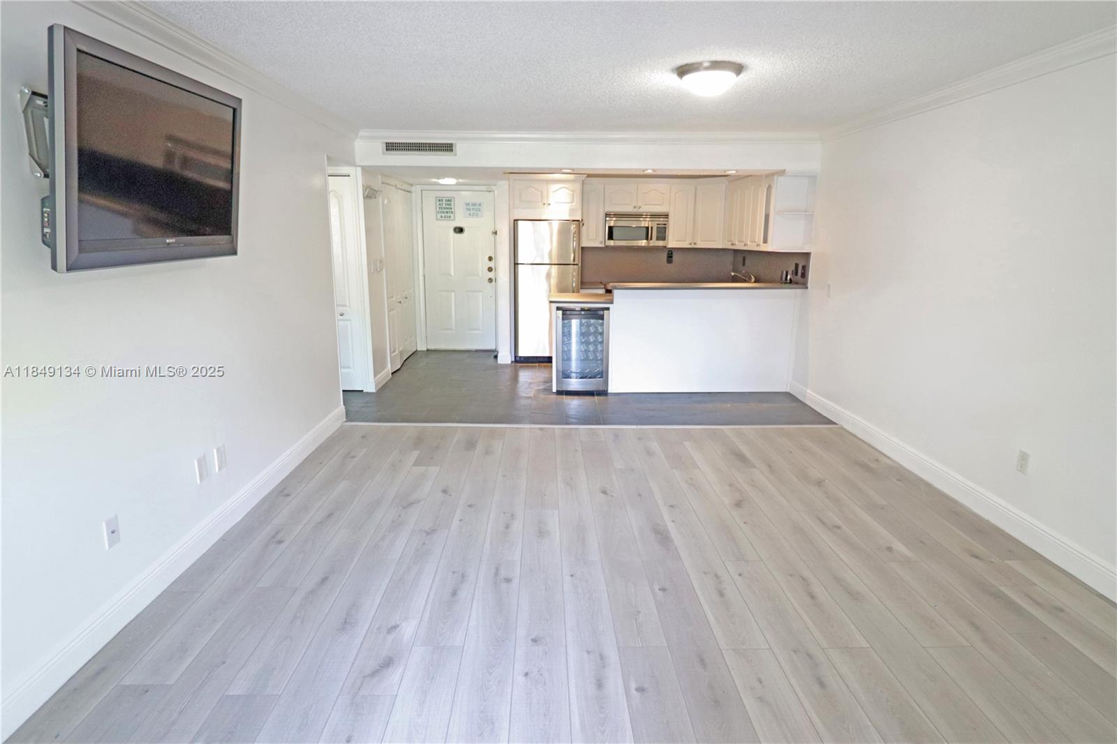 9301 Southwest 92nd Avenue, Unit A210 Miami, FL 33176 - Photo 6 of 25 a view of a kitchen with a sink and wooden floor