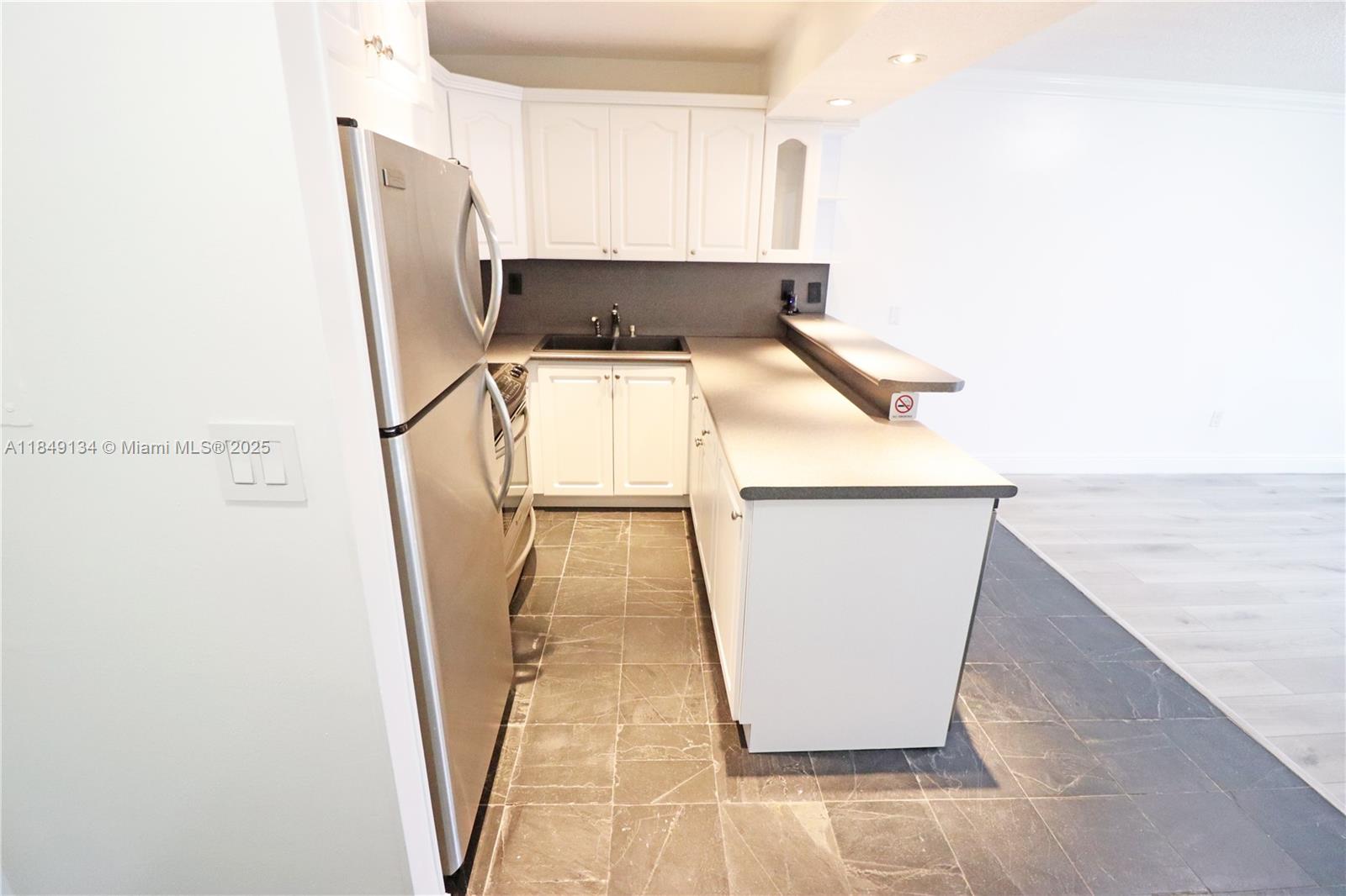 9301 Southwest 92nd Avenue, Unit A210 Miami, FL 33176 - Photo 9 of 25 a view of a kitchen with wooden floor