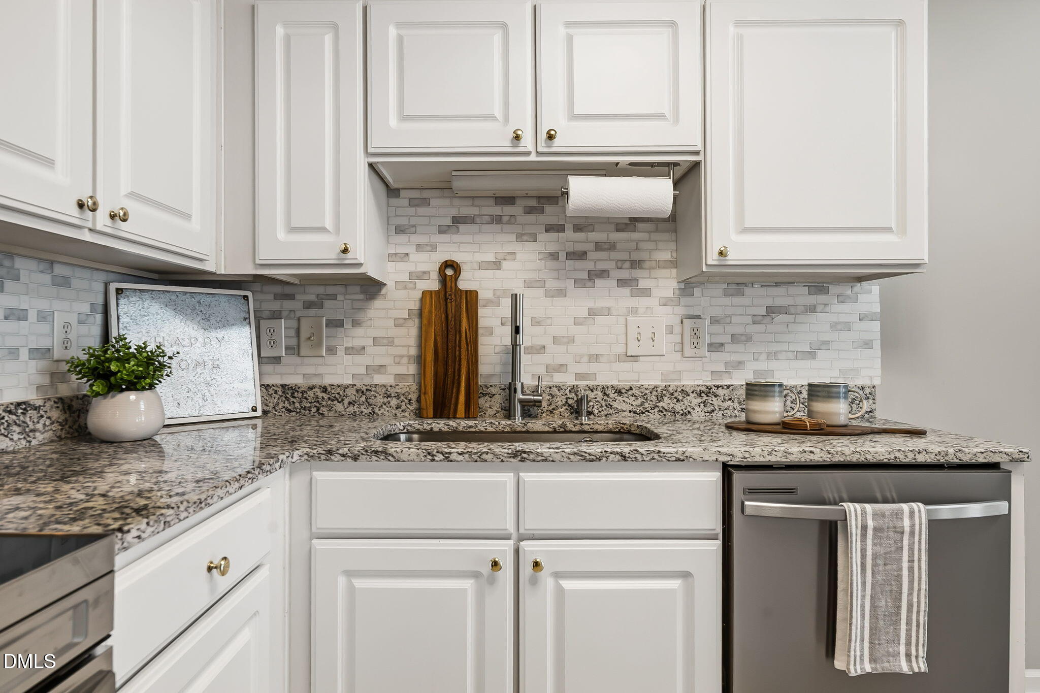 2501 Huntscroft Lane, Unit 100 Raleigh, NC 27617 - Photo 11 of 31 a kitchen with stainless steel appliances granite countertop white cabinets and a granite counter tops
