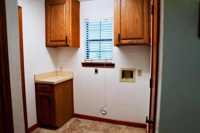 a bathroom with sink and window