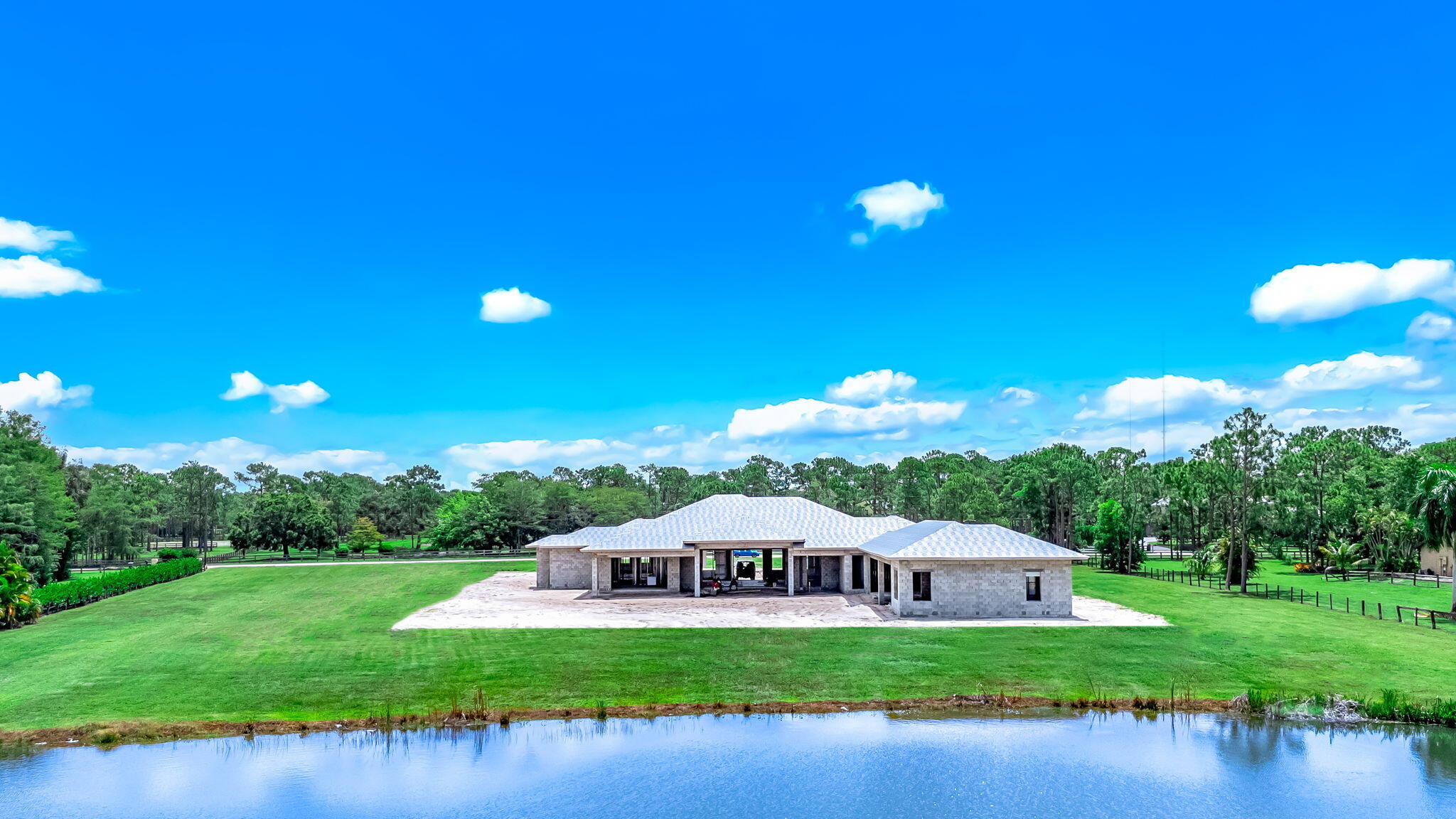 5593 Reynolds Road Lake Worth, FL 33449 - Photo 14 of 27 a view of a house with a big yard and a large tree