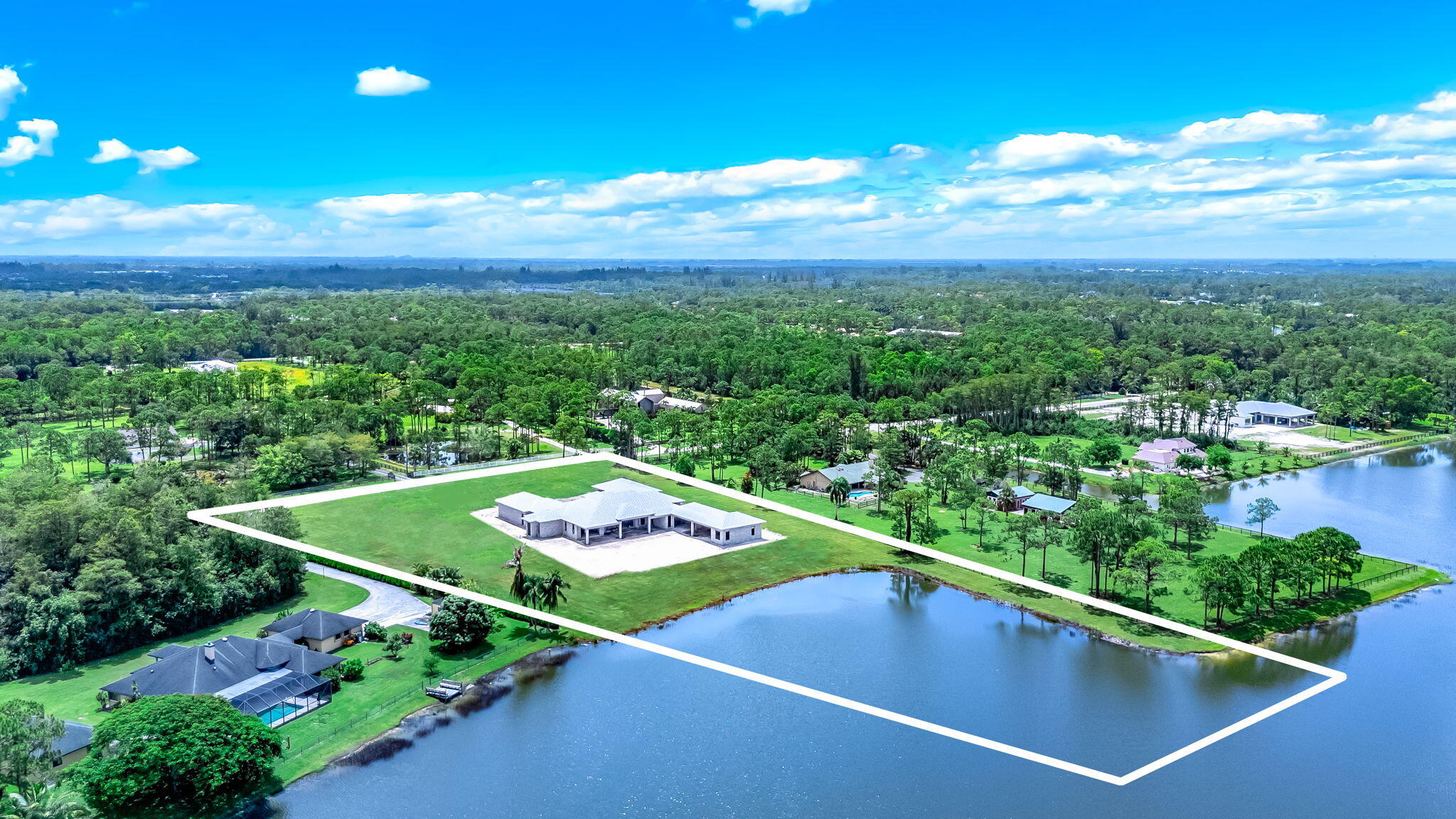 5593 Reynolds Road Lake Worth, FL 33449 - Photo 15 of 27 a view of a mini theater with a floor to ceiling window and outdoor view