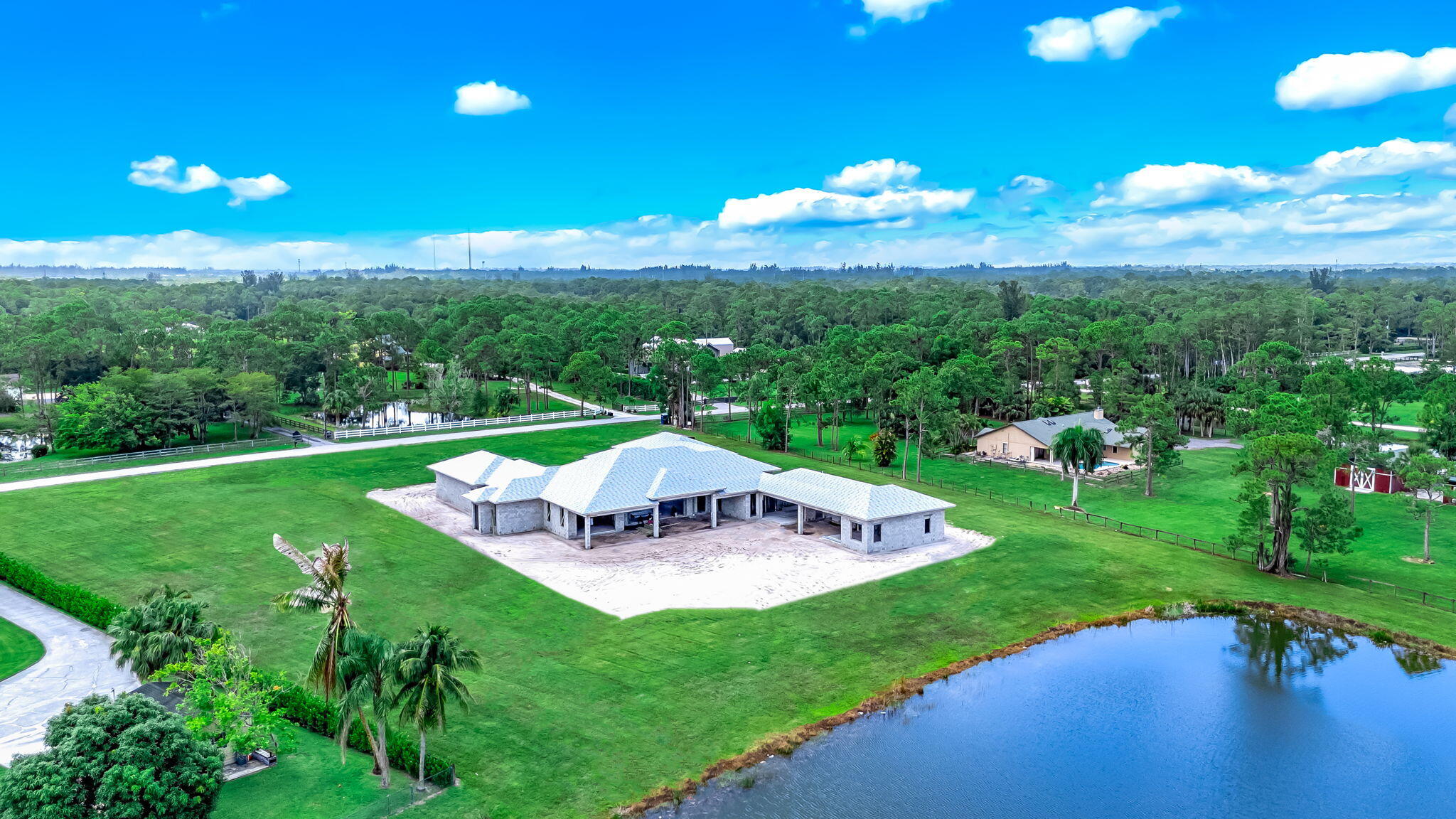 5593 Reynolds Road Lake Worth, FL 33449 - Photo 16 of 27 a view of a house with a yard and lake view