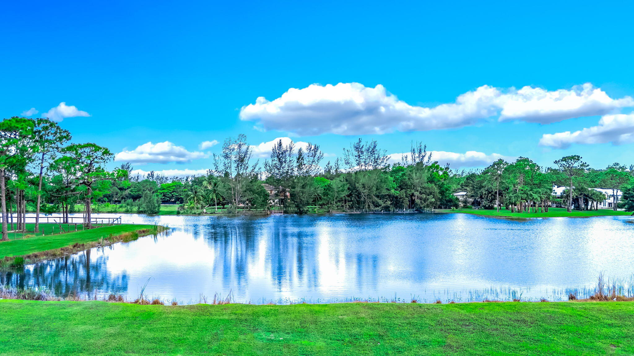 5593 Reynolds Road Lake Worth, FL 33449 - Photo 18 of 27 a view of a lake with a big yard