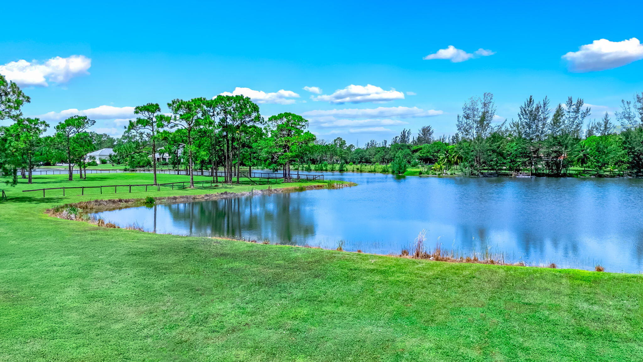 5593 Reynolds Road Lake Worth, FL 33449 - Photo 19 of 27 a view of a lake with a big yard