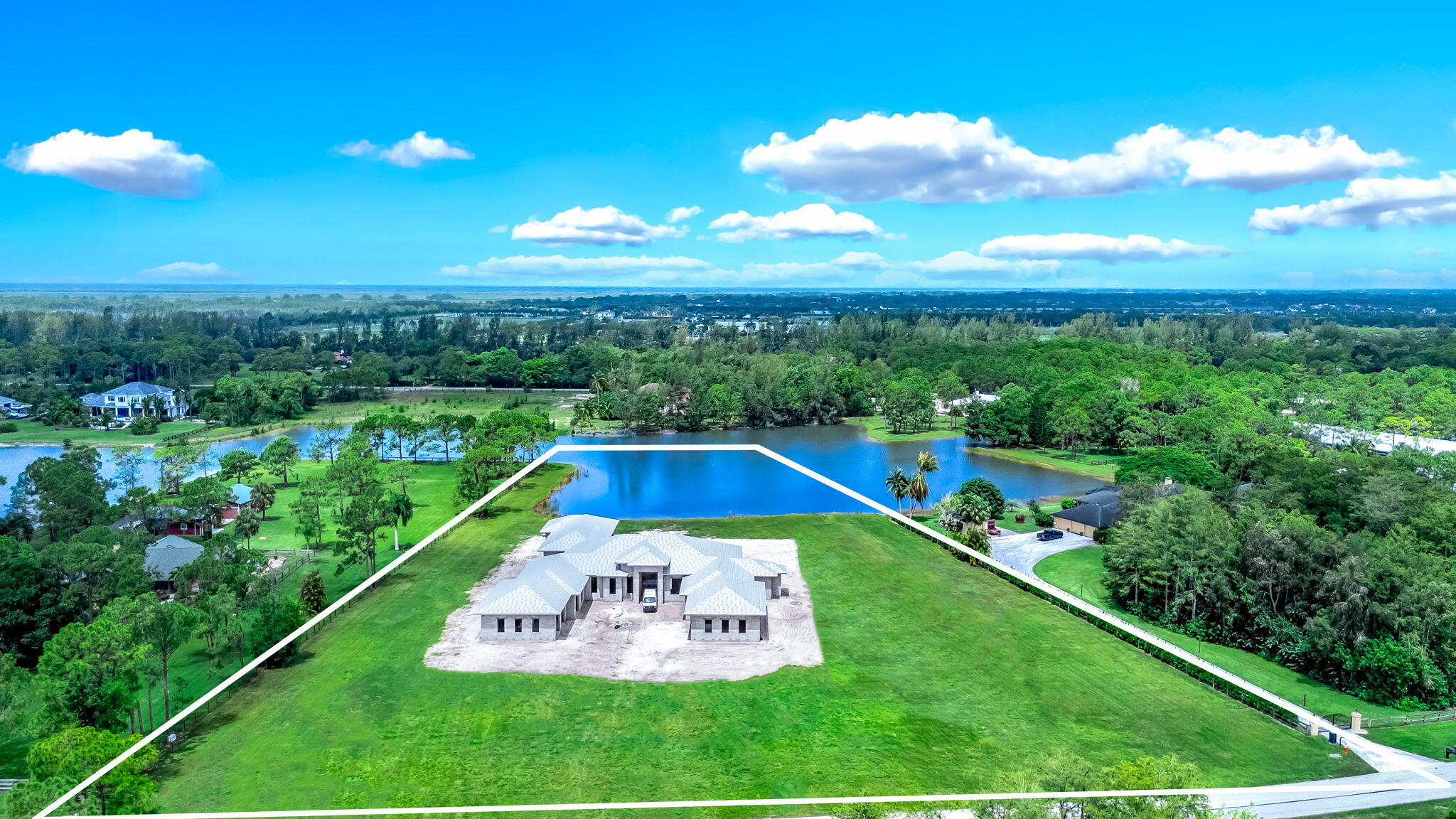 5593 Reynolds Road Lake Worth, FL 33449 - Photo 10 of 27 a view of a swimming pool with a garden