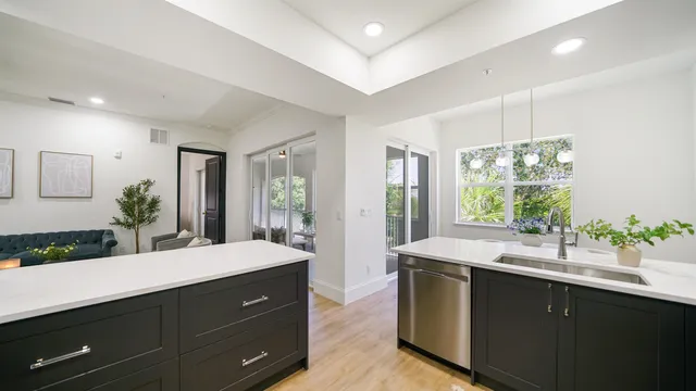 a bathroom with a double vanity sink and large mirror